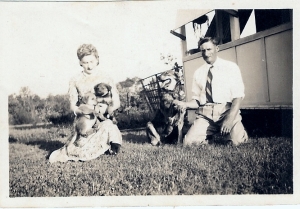 Olive with father Gerald and dog, Dale and pups.